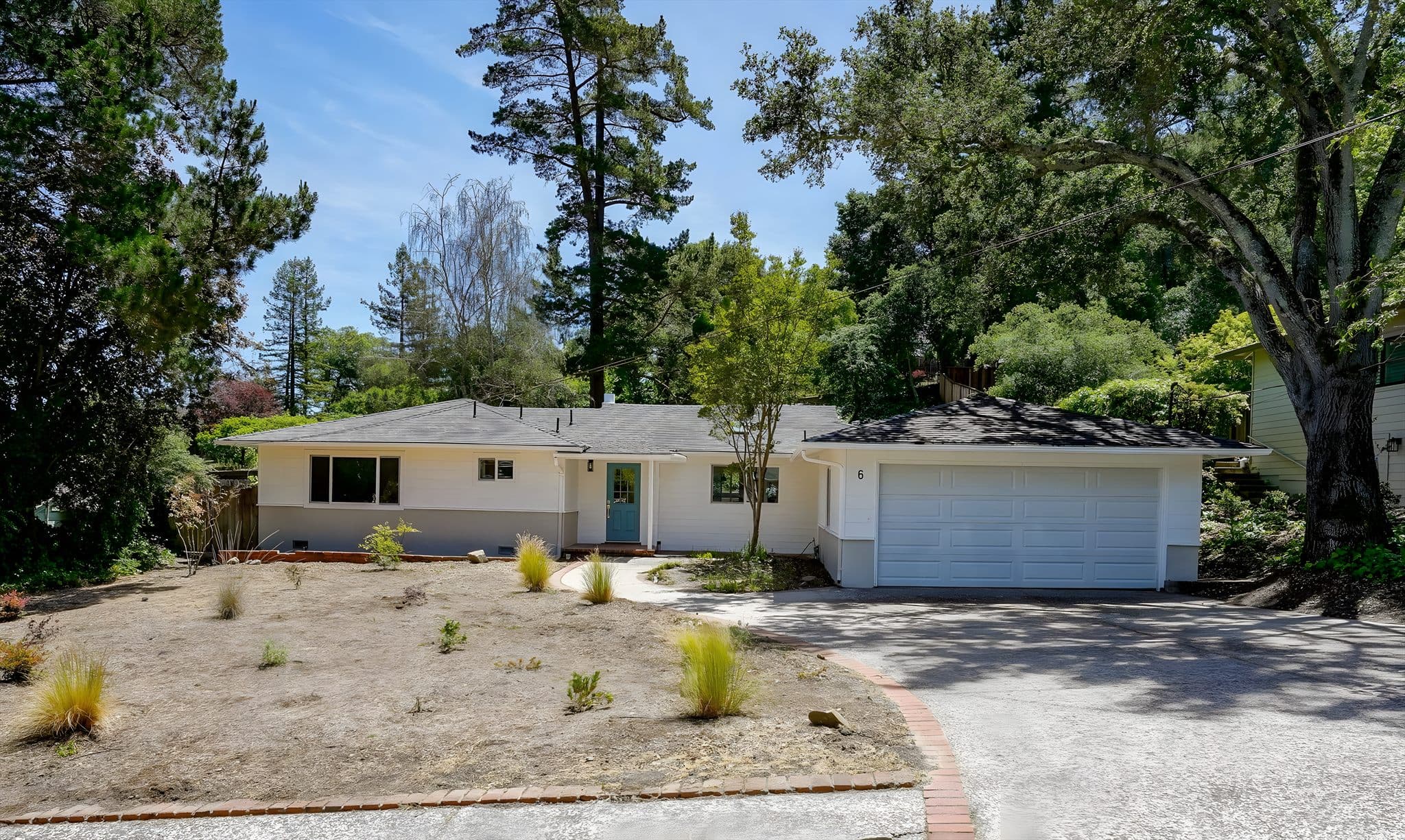 A Bay Vista–managed Bay Area home, framed by mature oaks on a bright afternoon.